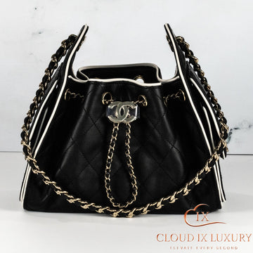 Chanel 25 Mini Black Leather with White Piping Handbag